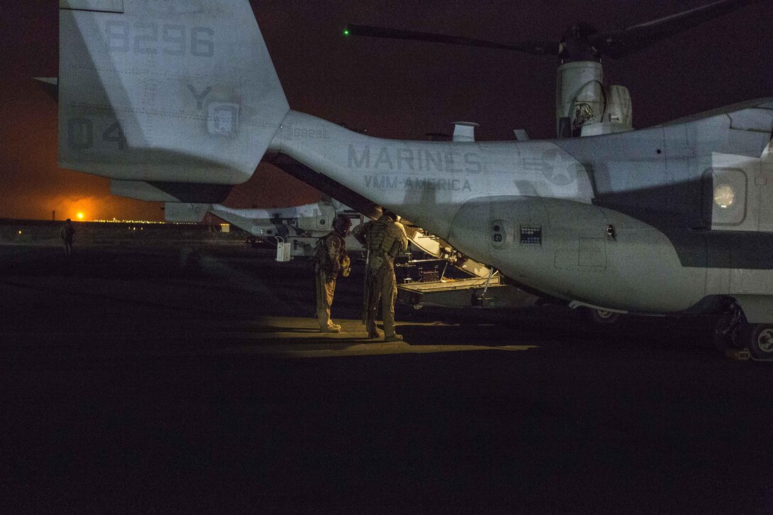 U.S. Marines conduct pre-flight checks on an MV-22 Osprey before a tail gun live-fire exercise in an undisclosed location in Southwest Asia, Dec. 20, 2015. U.S. Marine Corps photo by Lance Cpl. Clarence Leake