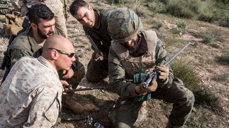 A Spanish soldier shows parts of a machine gun during a week-long bilateral exercise between U.S. Marines and Spanish Legionnaires in Almeria, Spain, Dec. 14-18, 2015. The combined urban and mountain warfare training is another bilateral training opportunity strengthening the U.S. and Spanish military relationship.