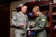 Col Kristin Goodwin, 2nd Bomb Wing commander, talks with Col Tom Wilcox, 341st Missile Wing commander, during a recent visit to Malmstrom Air Force Base, Dec. 16, 2015. The wing commanders of Barksdale Air Force Base’s 2nd BW and Malmstrom Air Force Base’s 341st MW recently formalized a “sister-base” partnership - officially called the Bomber Missile Exchange Course - that will enable warfighters from each organization to mix with and learn from one another through regularly scheduled cross-flow opportunities. (U.S. Air Force photo/Airman 1st Class Megan M. Reeves)