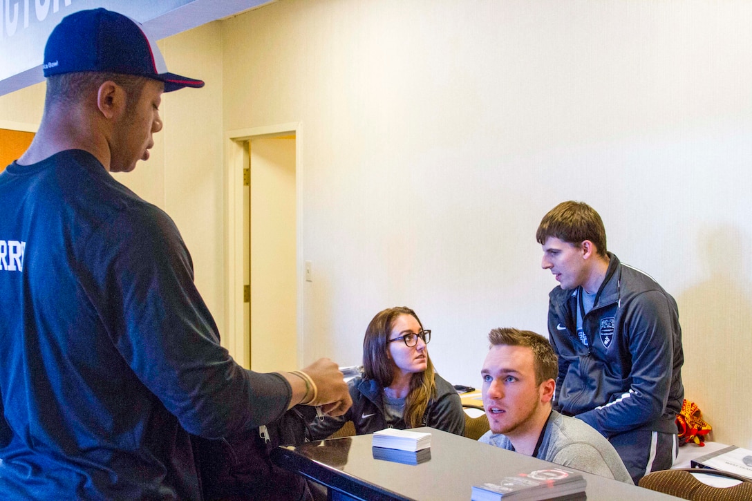 John-Michael Terry speaks with staff for registration during check-in for the Semper Fidelis All-American Bowl 2016, held at Hyatt Regency Hotel in Garden Grove, California, on Dec. 28, 2015. These students were not only selected for their performance on the field, but also the relationship they have built within their community and their academic accomplishments “I want to definitely learn from the Marines and the hard work and the things that they will instill in me over the next week in these practices, and just learn things from them I can take back to Oklahoma,” said Terry.  Terry is a linebacker for Victory Christian High School in Tulsa, Oklahoma. (U.S. Marine Corps photo by Cpl. Mark Adams/ Released)