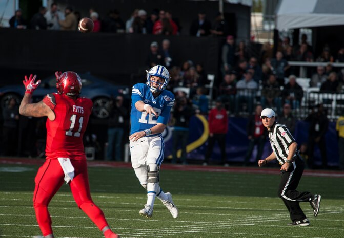 Brigham Young University quarterback Tanner Mangum attempts a pass during the Royal Purple Las Vegas Bowl at Sam Boyd Stadium in Las Vegas, Dec. 19, 2015. After falling behind early to the Utah Utes 35-0, the BYU Cougars rallied late in the game but fell short 35-28. (U.S. Air Force photo by Senior Airman Thomas Spangler)