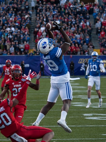 Brigham Young University wide receiver Davon Blackman catches a long pass during the Royal Purple Las Vegas Bowl at Sam Boyd Stadium in Las Vegas, Dec. 19, 2015. Despite a late-game rally, the BYU Cougars lost to the Utah Utes 35-28. (U.S. Air Force photo by Senior Airman Thomas Spangler)