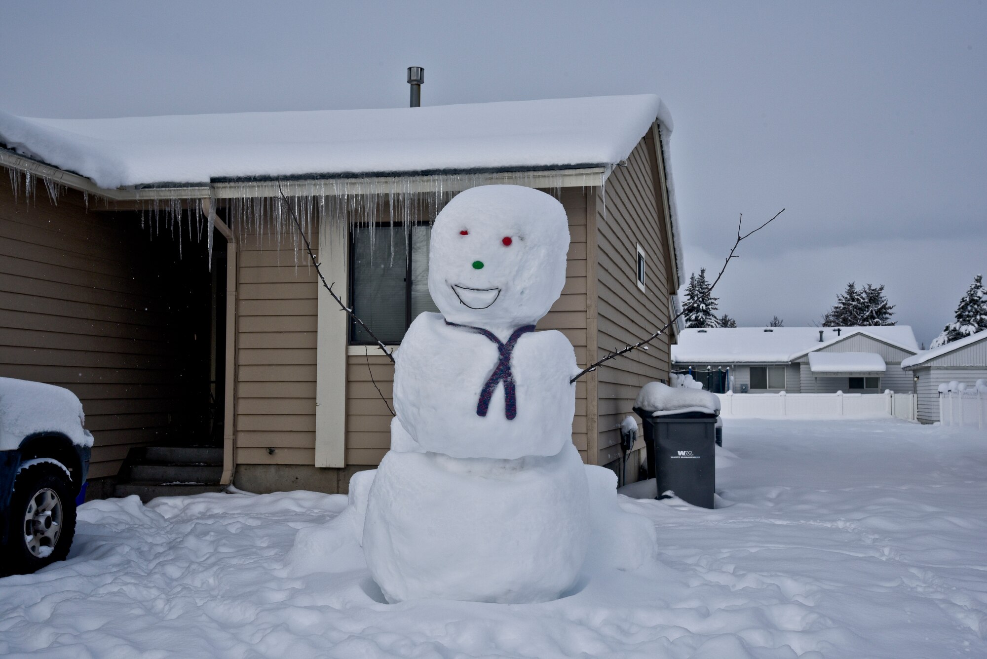A snowman stands tall in base housing on Fairchild Air Force Base, Wash. With the increased amount of snow this year many housing residents have decorated their lawns with different types of snow creations. (U.S. Air Force photo/Airman 1st Class Taylor Bourgeous)