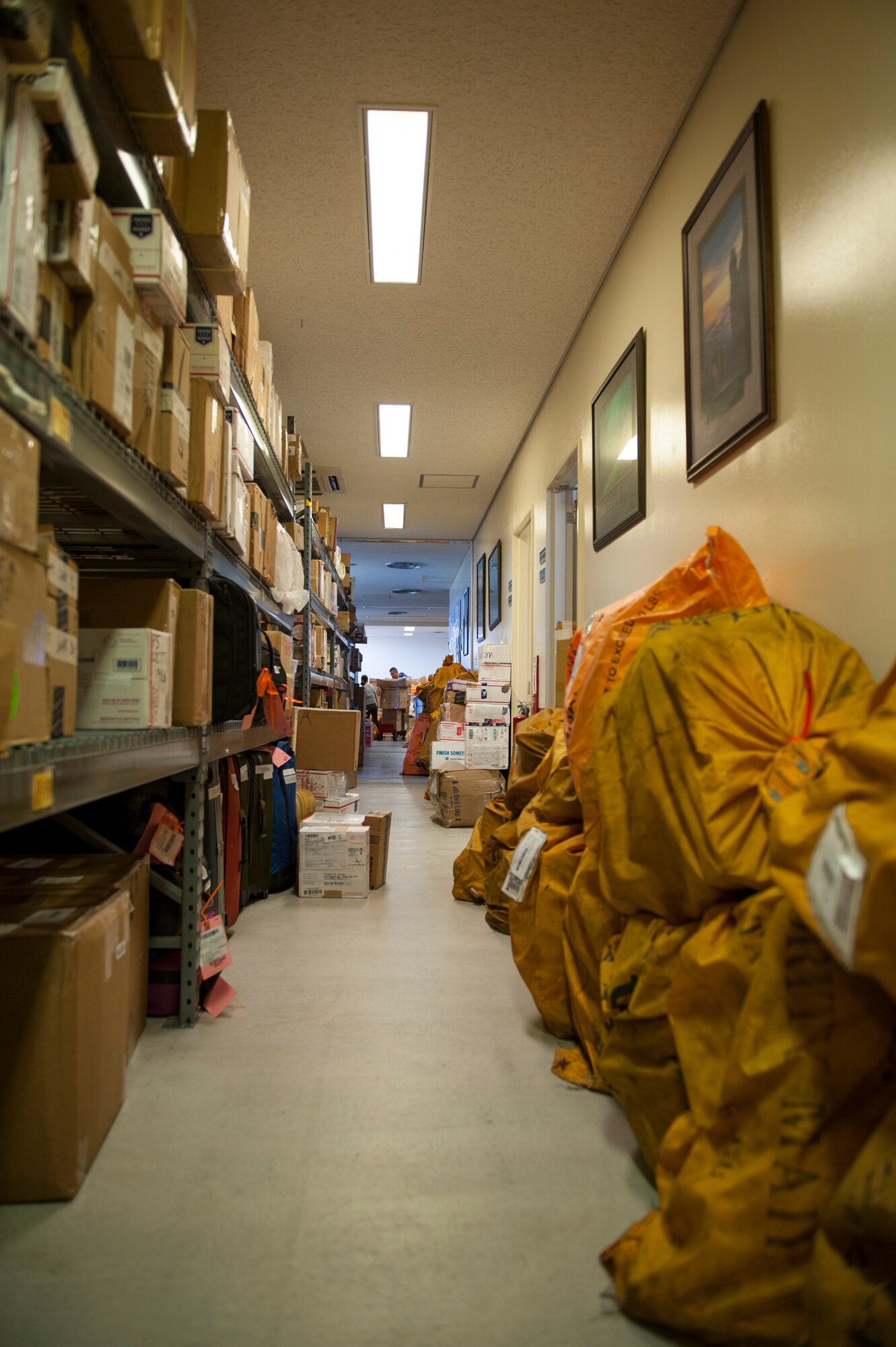 Packages fill the aisles in the back of the post office, Dec. 30, 2015, at Kadena Air Base, Japan. The post office processes more than 1,000 packages daily during the holiday season. (U.S. Air Force photo by Airman Zackary A. Henry)