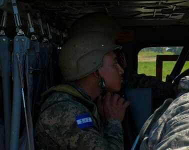 A Honduran soldier straps into a U.S. Army UH-60 Blackhawk Dec. 16, 2015, during U.S. supported troop movement in the Gracias a Dios Department (state) of Honduras. The troop was a part of more than 4,900 Honduran personnel the U.S. helped access hard to reach locations in the department since October 2014, where disrupting drug trafficking has been a primary focus for the Honduran government. (U.S. Air Force photo by Capt. Christopher Mesnard/Released)