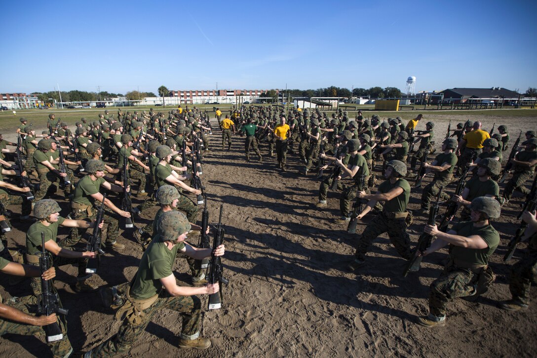 Marine Corps recruits practice bayonet techniques on Parris Island, S.C., Dec. 10, 2015. The techniques are part of the Marine Corps Martial Arts Program, which increases warfighting capabilities and enhances self-confidence and esprit de corps. Golf Company is scheduled to graduate Feb. 26, 2016. U.S. Marine Corps photo by Lance Cpl. Aaron Bolser