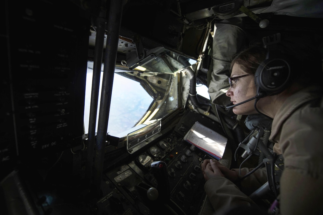 U.S. Air Force Senior Airman Rebekah McCormack looks out the boom pod window of a KC-135 Stratotanker over Iraq, Dec. 22, 2015. McCormack is a boom operator assigned to the 340th Expeditionary Air Refueling Squadron, deployed out of the 351st Air Refueling Squadron in RAF Mildenhall, England. U.S. Air Force photo by Staff Sgt. Corey Hook