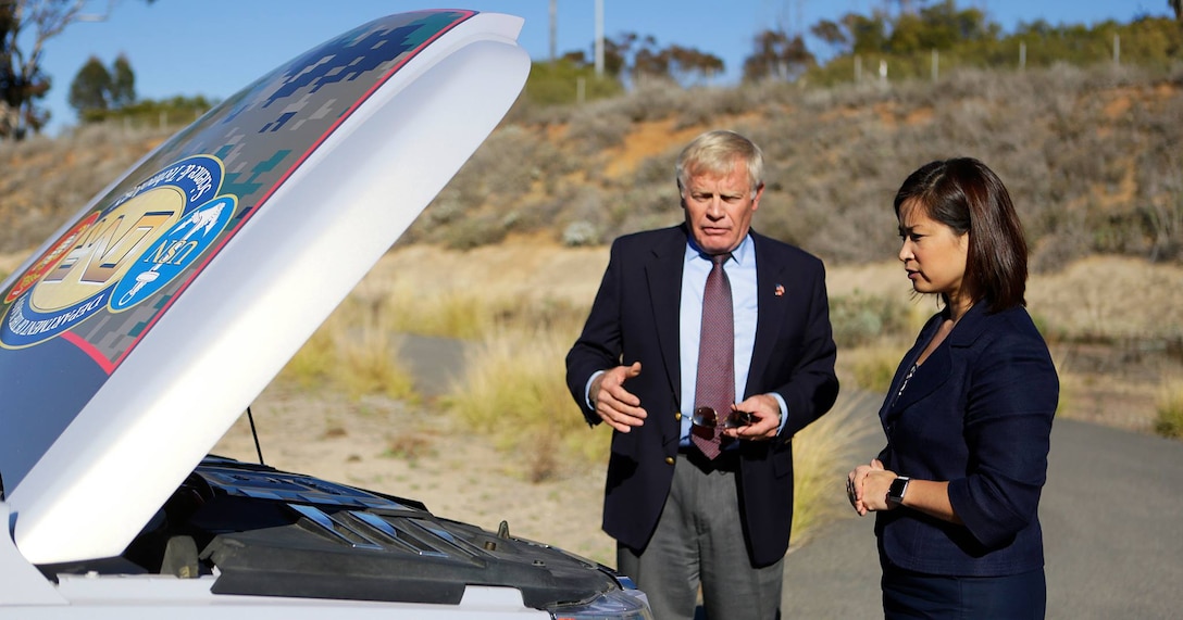 Gary Funk, deputy assistant chief of staff logistics, gives a presentation on the proposed hydrogen refueling station and zero emission vehicle fleet to Christine Harada, the chief sustainability officer for the White House, Dec. 29, 2015. The hydrogen refueling station is a part of Camp Pendleton's ongoing initiative to improve energy security and sustainability for the base. (Photo by Pfc. Emmanuel Necoechea)