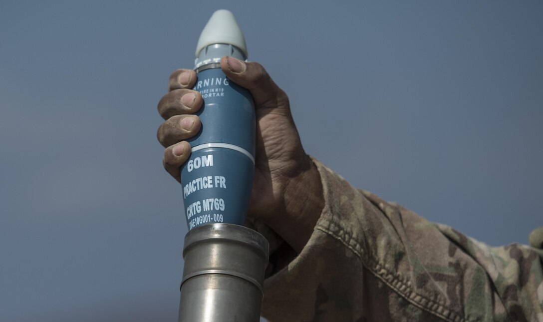 A U.S. soldier prepares to load a round into a M224 mortar system during a live-fire exercise near Camp Lemonnier, Djibouti, Dec. 16, 2015. U.S. Air Force photo by Senior Airman Cory D. Payne