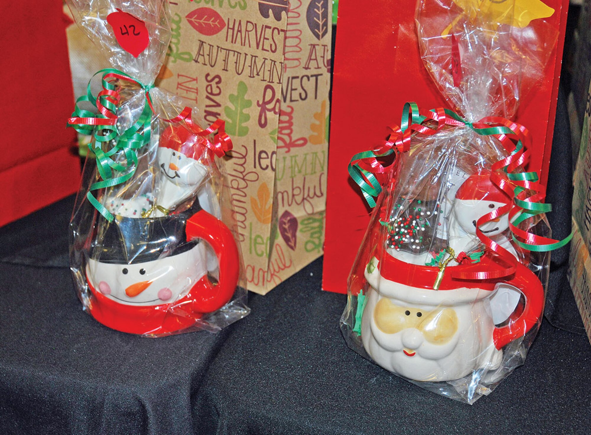 Members brought objects like the mugs full of good¬ies, above, that they made, bought or baked for the annual Make it, Bake it, Fake it luncheon at Riley’s Conference Center Nov. 19.