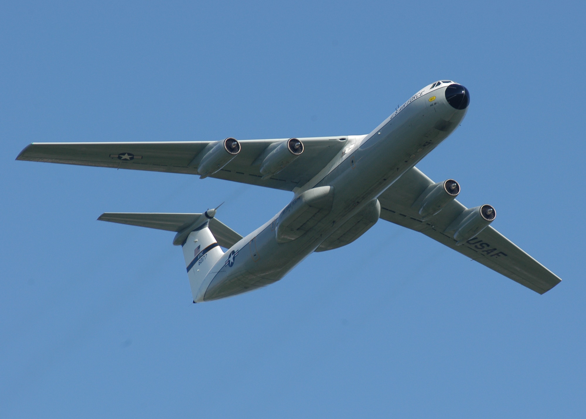 The C-141 "Hanoi Taxi" performs a fly-by at the National Museum of the U.S. Air Force during its final flight on May 6, 2006. The "Hanoi Taxi" was the first aircraft to return Vietnam prisoners of war to the United States on Feb. 12, 1973. (U.S. Air Force photo by Jeff Fisher)