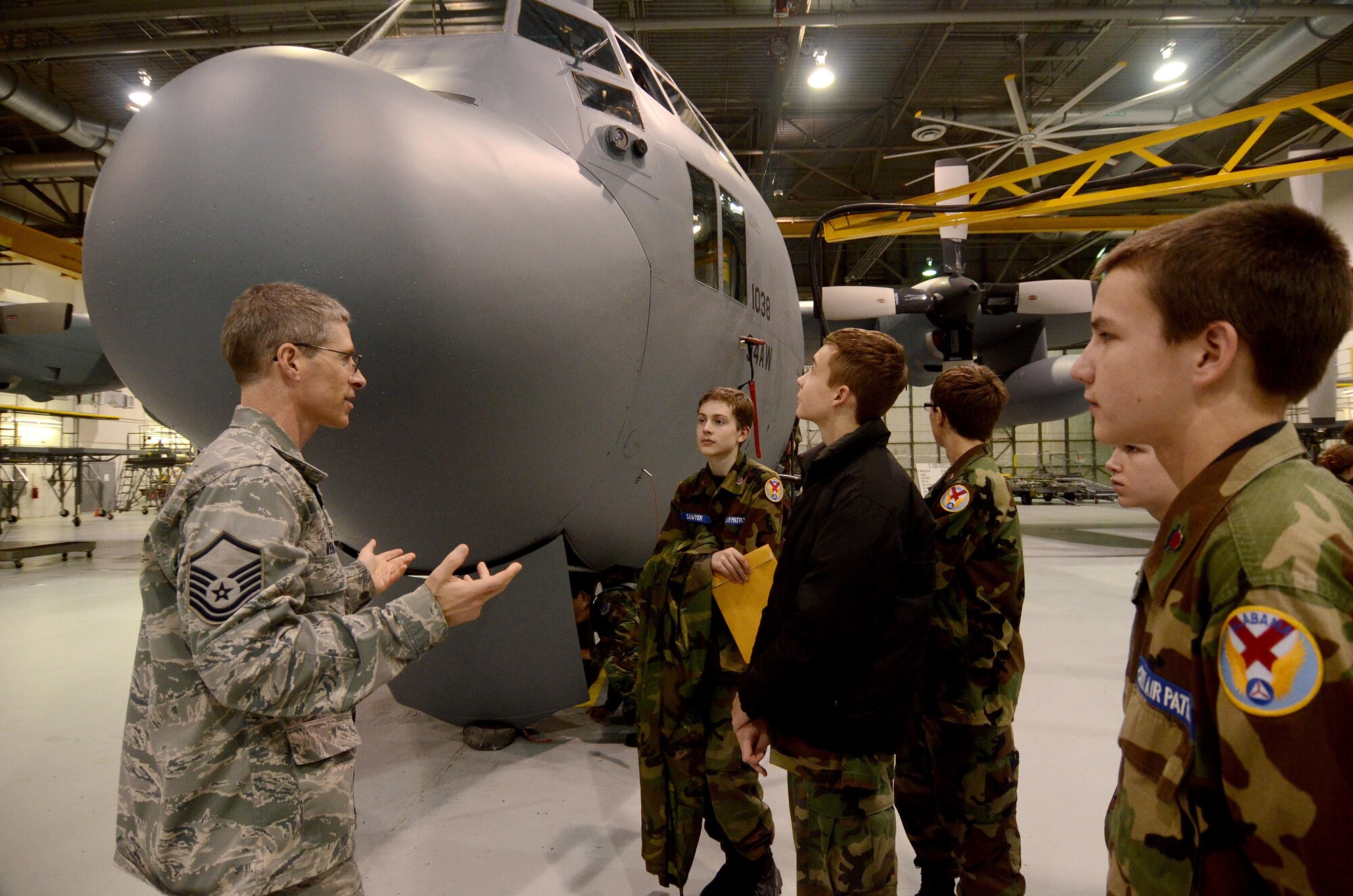 Master Sgt. Ronald Vehrs from the 94th Maintenance Squadron briefs Civil Air Patrol Cadets on maintenance operations involving the C-130 Hercules during a visit to Dobbins Air Reserve Base, Ga. Dec. 30, 2015. The cadets were from units in Georgia, Florida and Alabama. (U.S. Air Force photo/Don Peek)