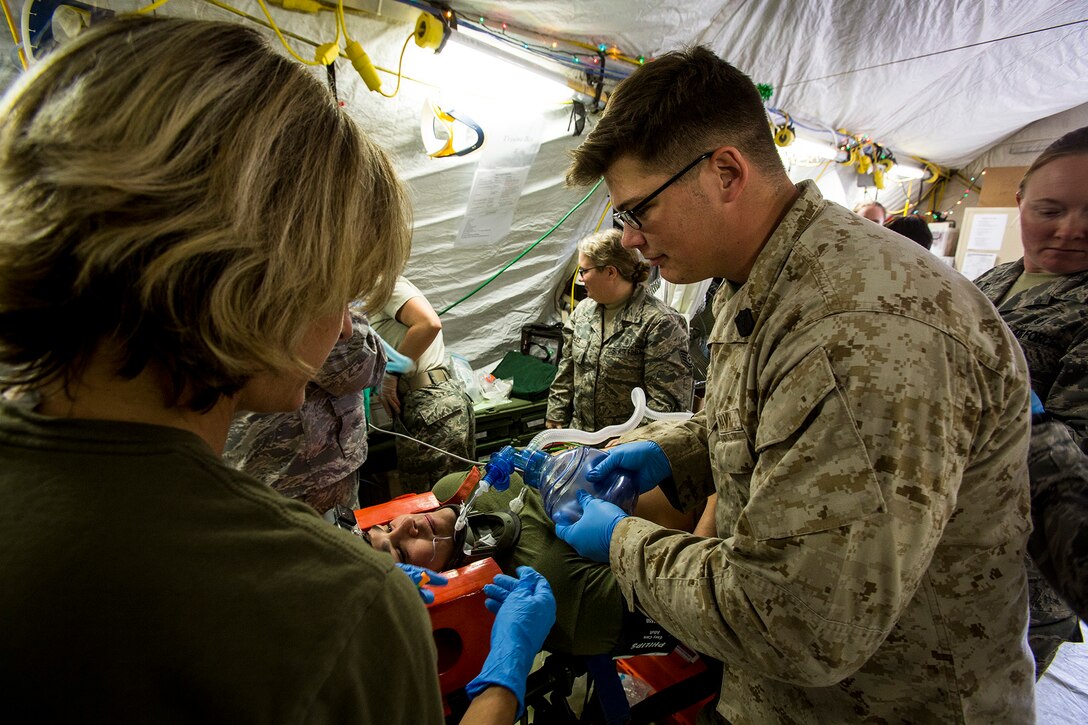 U.S. Navy medical personnel treat a simulated patient during a mass casualty exercise at an undisclosed location in Southwest Asia, Dec. 23, 2015. U.S. Marine Corps Photo by Sgt. Rick Hurtado