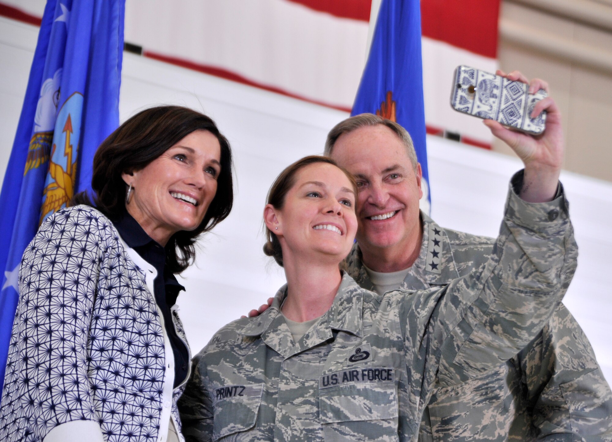 Chief of Staff of the Air Force Gen. Mark A. Welsh III, right, and his wife Betty Welsh, left, take a selfie with Master Sgt. Charlene Printz, 726th Operations Group NCO in charge of commanders support staff, after an all-call as part of the general's visit to Creech Air Force Base, Nevada, March 24, 2015. After the all-call Welsh and his wife, spoke and took photos with the men and women of Creech AFB. (U.S. Air Force photo by Airman 1st Class Christian Clausen/Released)