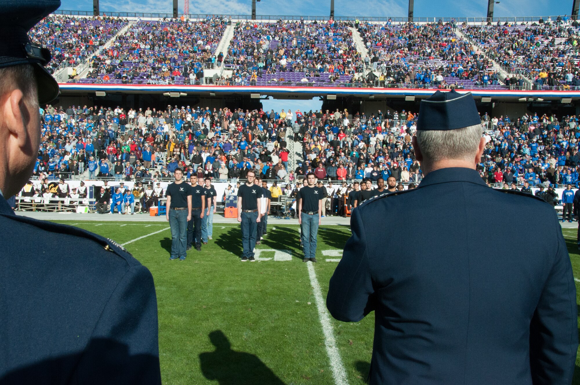 NAVAL AIR STATION FORT WORTH JOINT RESERVE BASE, Texas - Chief of Staff of the Air Force Gen. Mark A. Welsh III and 301st Fighter Wing Commander Col. John Breazeale stand before 25 Air Force recruits Dec. 29 during the halftime mass enlistment at the Armed Forces Bowl in Fort Worth, Texas.  The U.S. Air Force Academy and the University of California battled for the championship, but in the end the Bears beat the Falcons 55 to 36. (U.S. Air Force photo by Staff Sgt. Melissa Harvey)