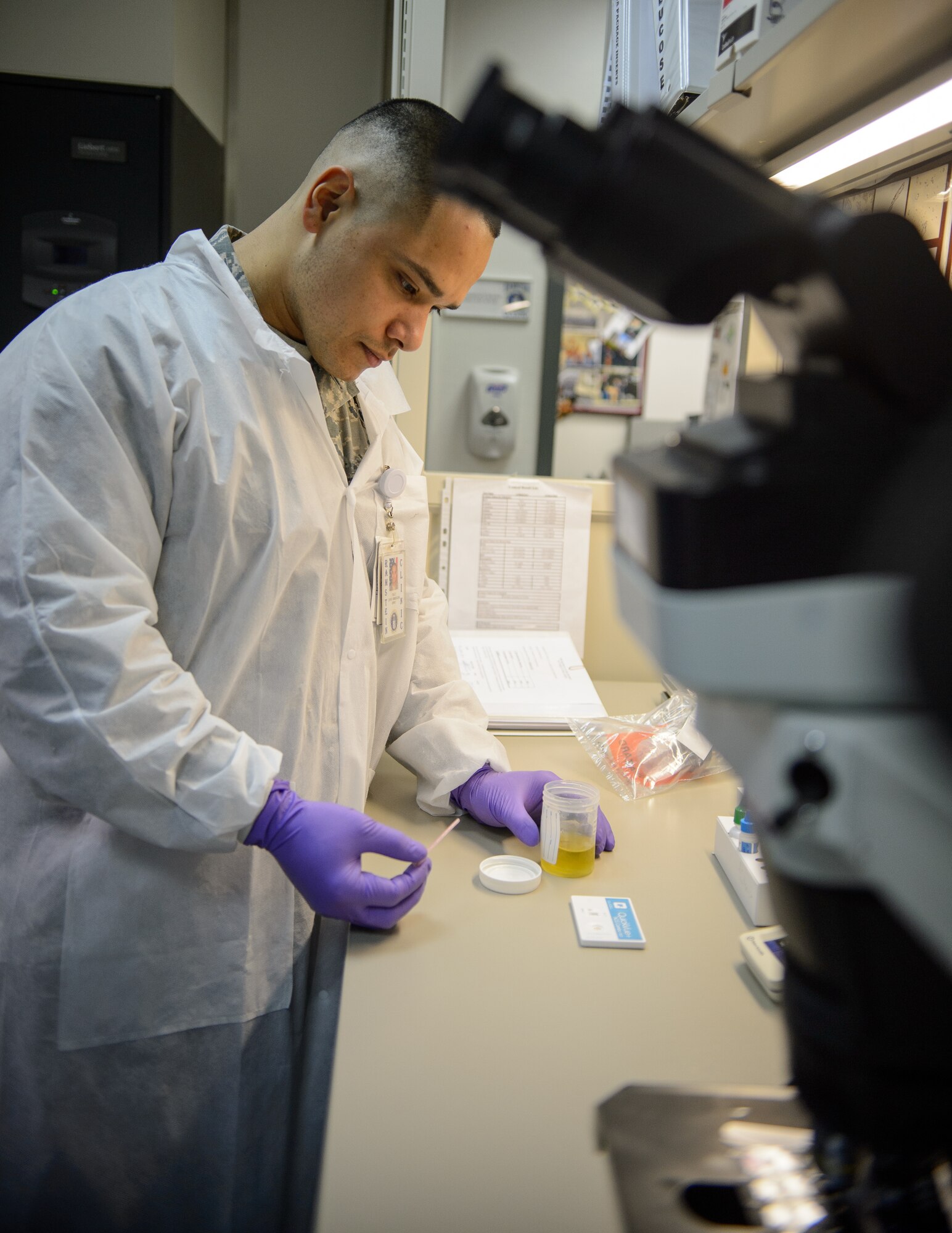 Tech. Sgt. Jose Obregon, 435th Contingency Response Support Squadron independent duty medical technician, conducts an expeditionary pregnancy test during a training session Dec. 18, 2015, at Ramstein Air Base, Germany. Obregon is one of three IDMTs who are qualified to conduct a variety of medical procedures normally performed by nurses and doctors while in the field. (U.S. Air Force photo/Staff Sgt. Armando A. Schwier-Morales)