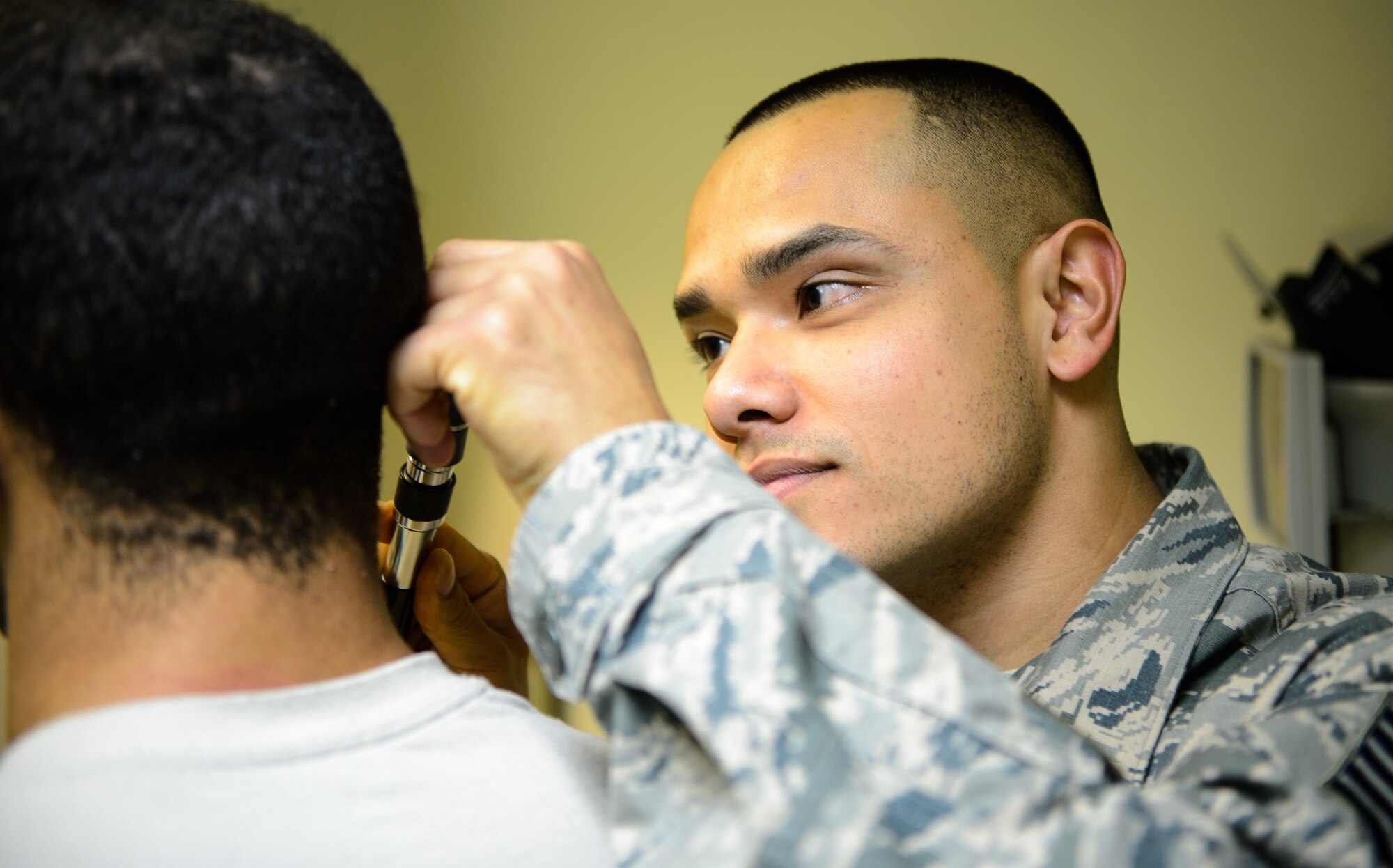 Tech. Sgt. Jose Obregon, 435th Contingency Response Support Squadron independent duty medical technician, examines a mock patient during a demonstration of IDMT duties Dec. 18, 2015, at Ramstein Air Base, Germany. IDMTs from the 435th Air Ground Operations Wing are not only required to know and understand tasks from the technician, nurse and doctor specializations but must also be qualified to jump alongside paratroopers establishing, building and maintaining an airfield. (U.S. Air Force photo/Staff Sgt. Armando A. Schwier-Morales)