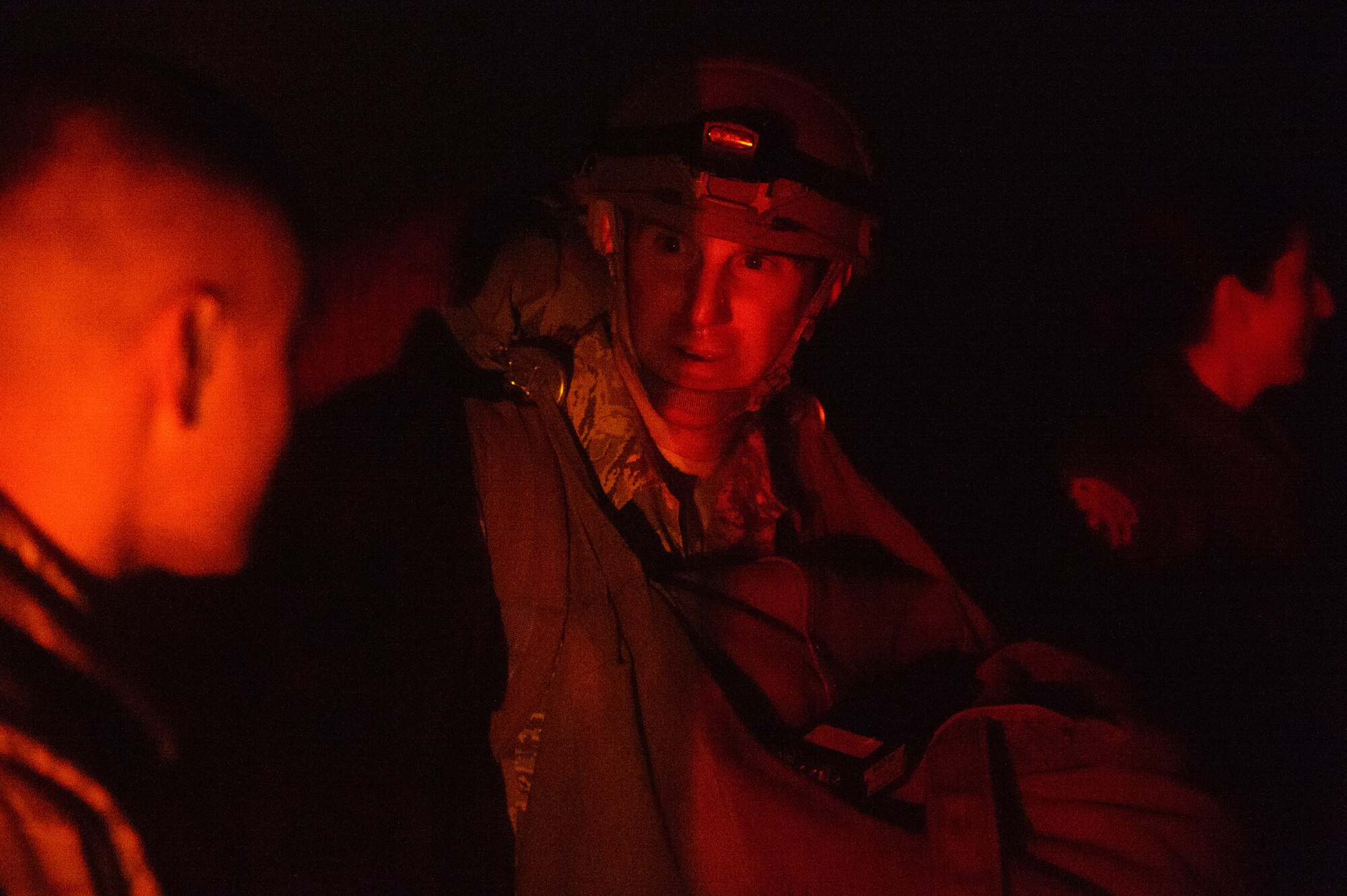Tech. Sgt. Jack Williams, 435th Contingency Response Support Squadron independent duty medical technician, speaks with a fellow IDMT after completing his first jump with the 435th CRSS Dec. 18, 2015, at Alzey Drop Zone, Germany. Williams and two other medics provide the services of a medical clinic in a small package as they open new bases for the Air Force with the 435th CRSS. (U.S. Air Force photo/Staff Sgt. Armando A. Schwier-Morales)