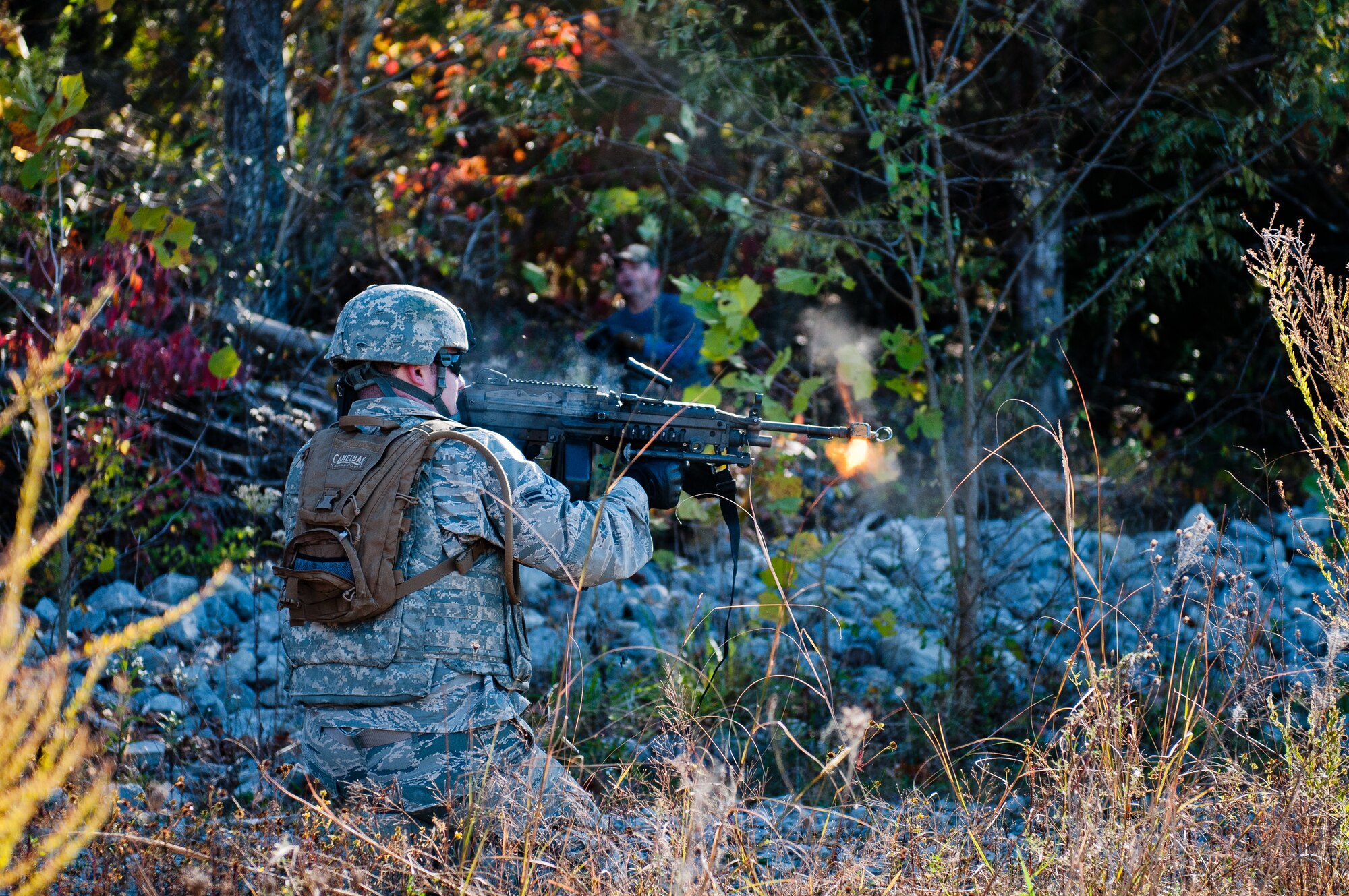 A Fire Team member from the Kentucky Air National Guard's 123rd Security Forces Squadron lays down suppressive fire during a field training exercise at Ft. Knox, Ky., Oct. 20, 2015. Unit members were being evaluated on their ability to extract a downed pilot from a simulated Afghan village. (Kentucky Air National Guard photo by Master Sgt. Phil Speck)