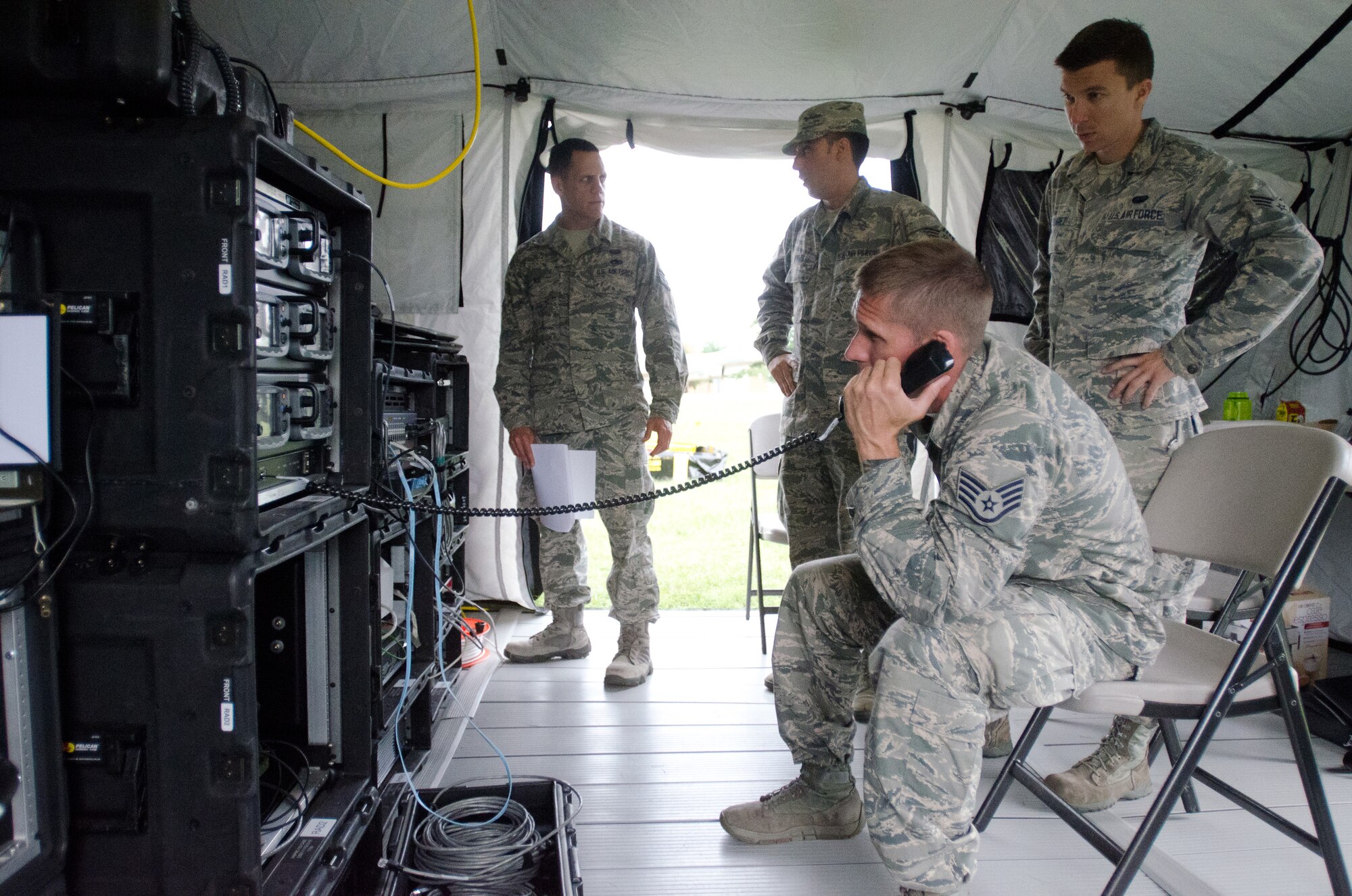 Staff Sgt. Chance Harrig, NCOIC of radio frequency communications for the 123rd Communications Flight, tests telephone capabilities during a state-wide communication exercise at the Kentucky Air National Guard Base in Louisville, Ky., June 25, 2015. The Kentucky National Guard and multiple federal, state and local agencies participated in the week-long exercise, designed to test the agencies’ ability to communicate with each other during emergencies. (Kentucky Air National Guard photo by Master Sgt. Phil Speck)