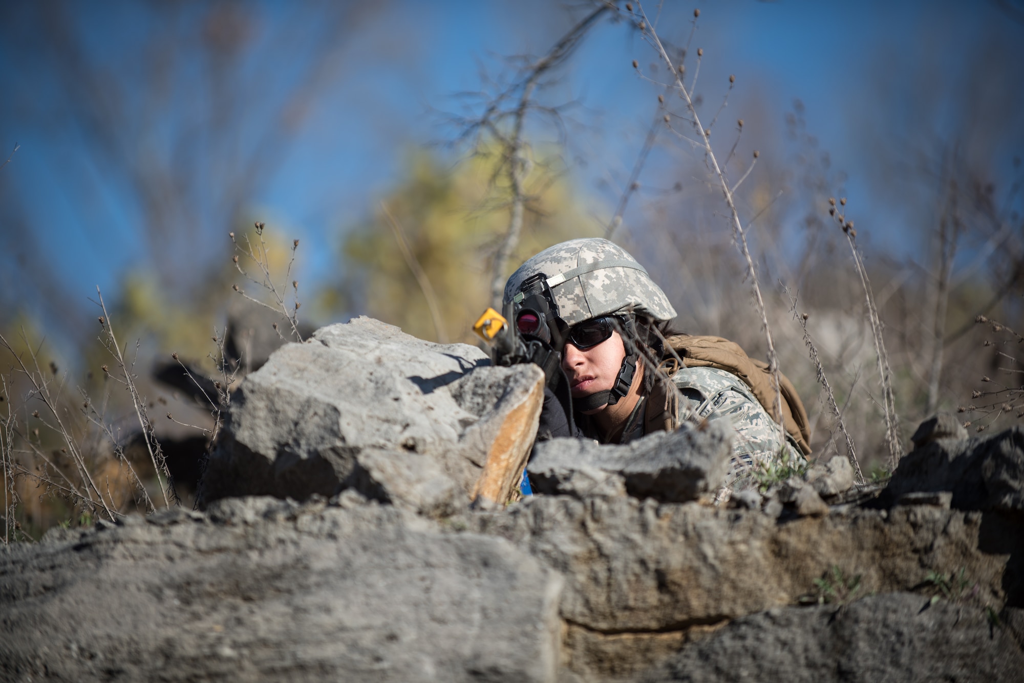 A Fire Team member from the Kentucky Air National Guard’s 123rd Security Forces Squadron provides cover as his teammates search for a simulated downed pilot inside a mock Afghan Village at Fort Knox, Ky., Oct. 20, 2015. The Airmen were required to execute a coordinated search while defending their positions and engaging hostile forces. (U.S. Air National Guard photo by Maj. Dale Greer)