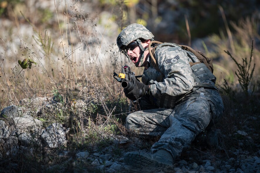 Senior Airman Randy Roberts, a Fire Team leader from the Kentucky Air National Guard’s 123rd Security Forces Squadron, provides cover as his teammates extract a simulated downed pilot from a mock Afghan Village at Fort Knox, Ky., Oct. 20, 2015. The Airmen were required to execute a coordinated search while defending their positions and engaging hostile forces. (U.S. Air National Guard photo by Maj. Dale Greer)
