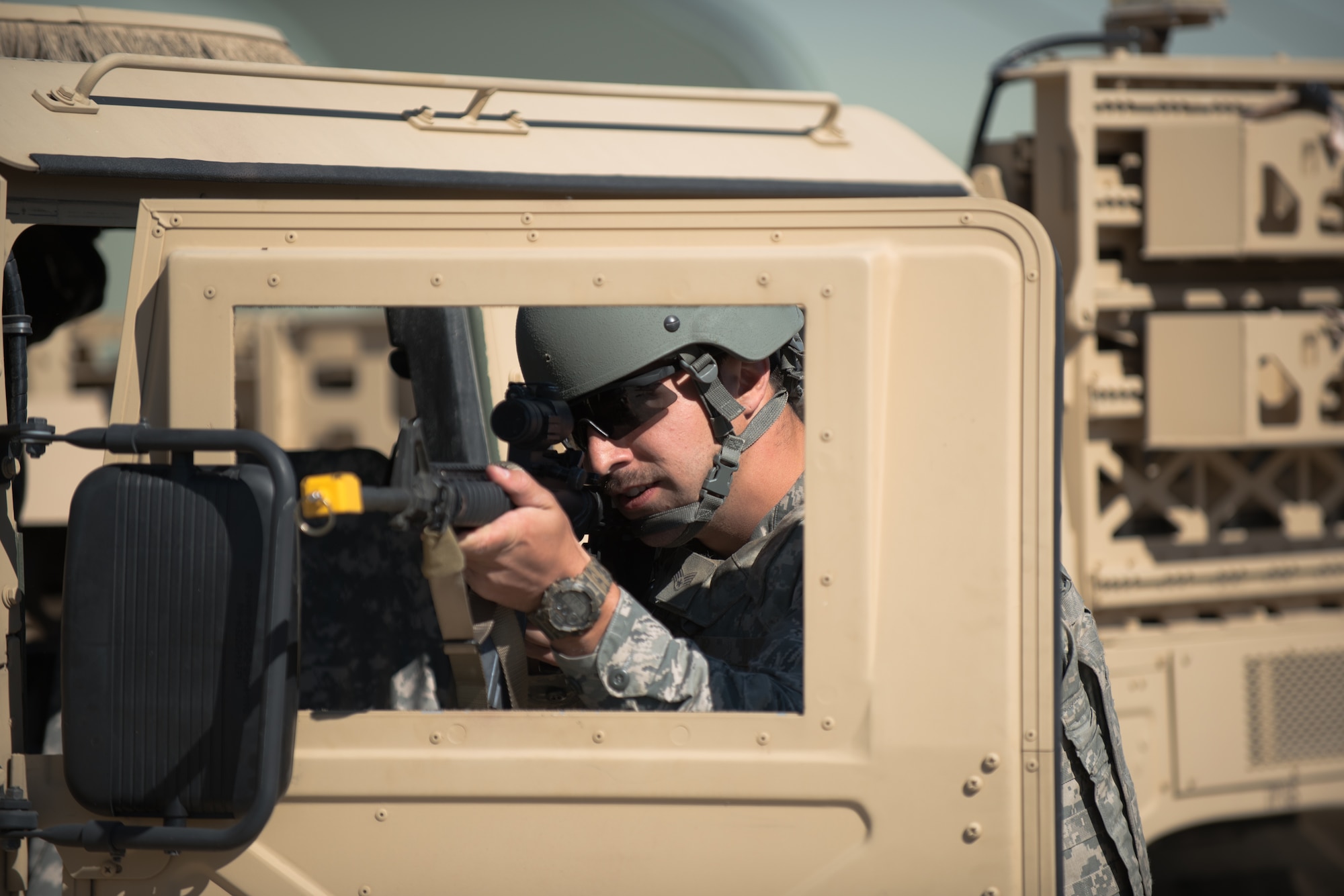 Senior Airman Travis Vance, a Fire Team leader from the Kentucky Air National Guard’s 123rd Security Forces Squadron, defends his position inside a simulated Afghan military compound during training at Fort Knox, Ky., Oct. 20, 2015. Vance and his fellow Airmen also executed a search for a downed pilot. (U.S. Air National Guard photo by Maj. Dale Greer)