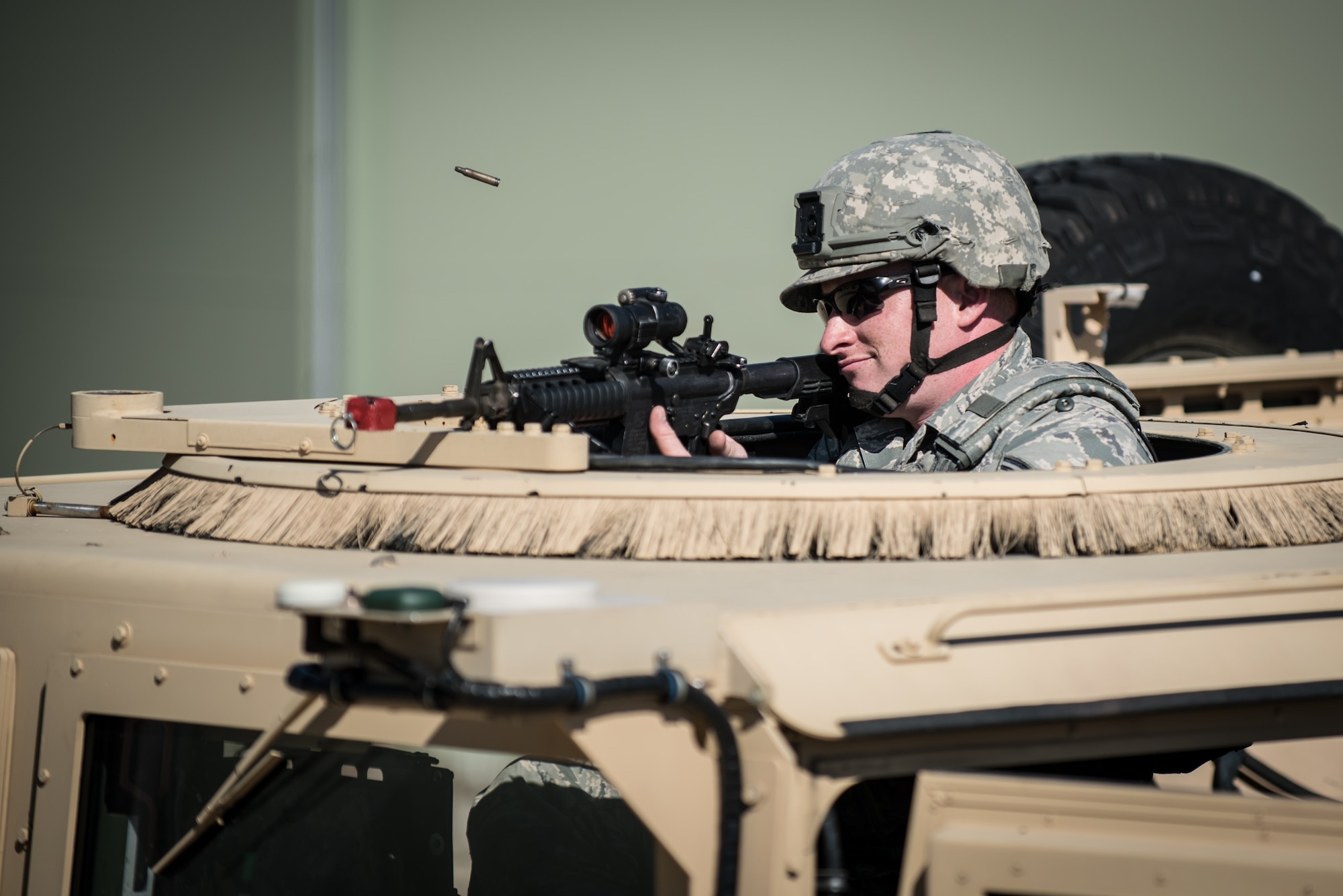 Senior Airman Jacob Faith, a Fire Team member from the Kentucky Air National Guard’s 123rd Security Forces Squadron, defends his position under fire while protecting a simulated Afghan compound during training at Fort Knox, Ky., Oct. 20, 2015. Faith and his fellow Airmen also executed a search for a downed pilot. (U.S. Air National Guard photo by Maj. Dale Greer)