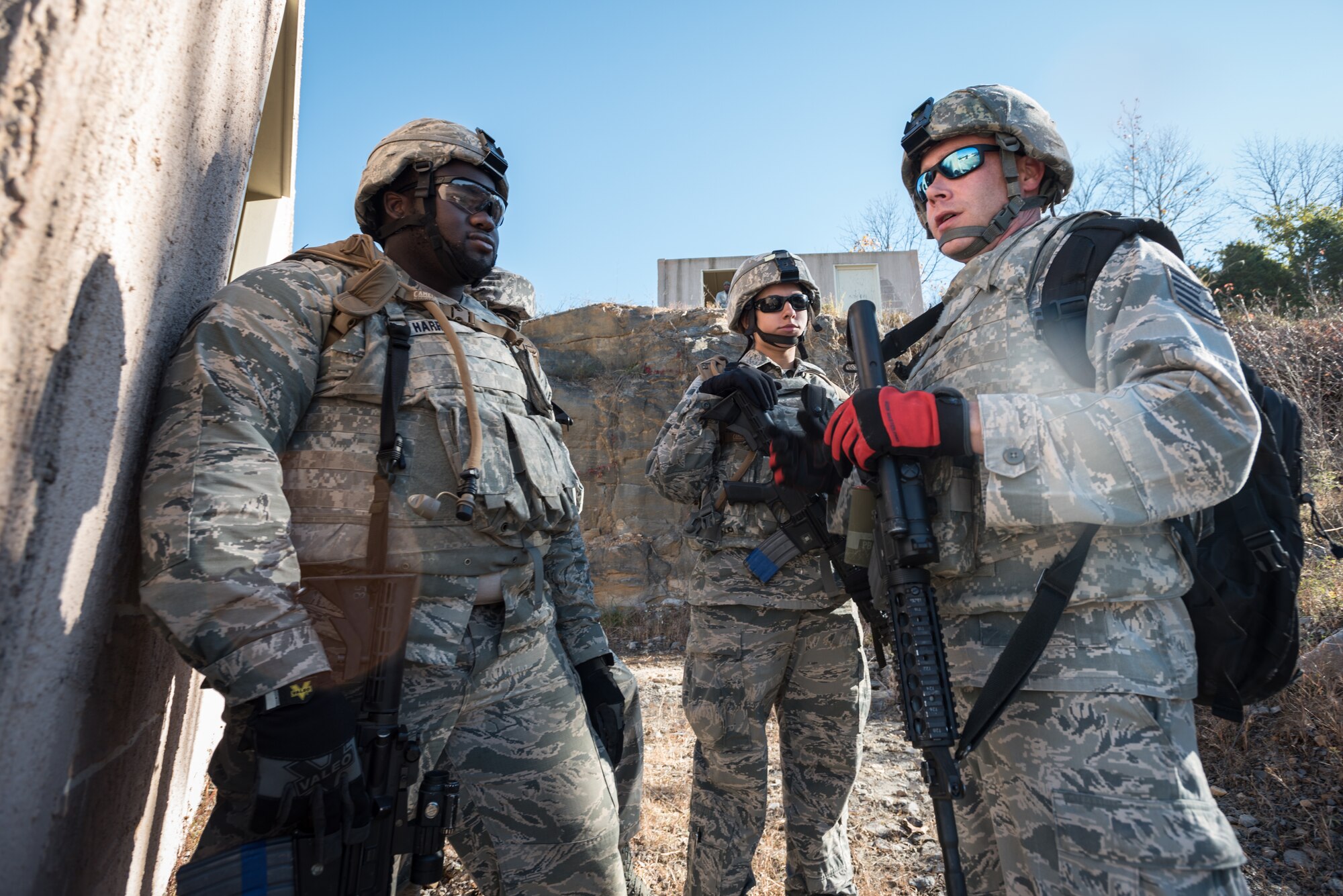 Senior Airman Aaron Harris, Senior Airman Megan Mayes and Tech. Sgt. Gary Coy (left to right), all Fire Team members from the Kentucky Air National Guard’s 123rd Security Forces Squadron, conduct training to recover a downed pilot inside a simulated Afghan Village at Fort Knox, Ky., Oct. 20, 2015. The Airmen were required to execute a coordinated search while defending their positions and engaging hostile forces. (U.S. Air National Guard photo by Maj. Dale Greer)