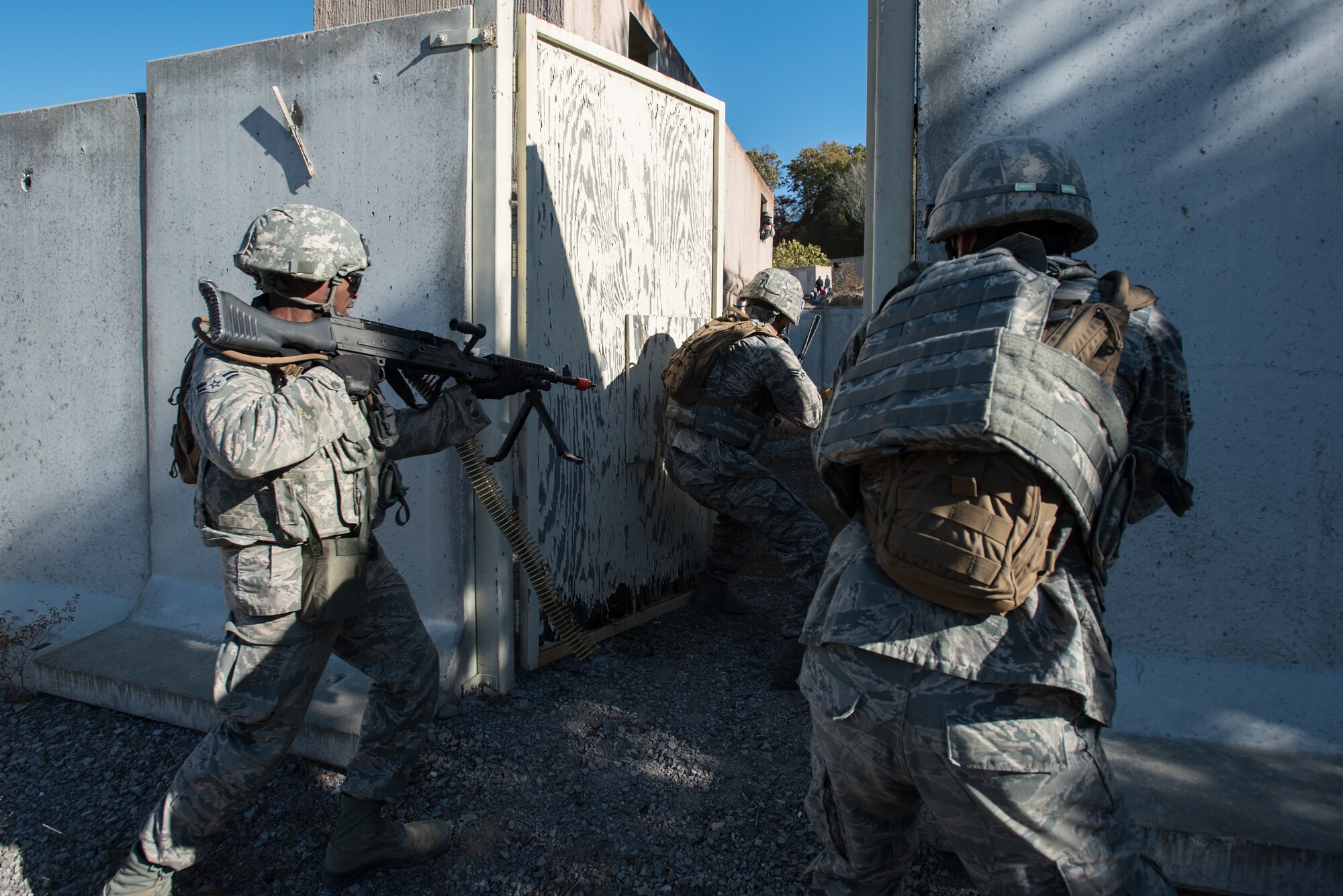 Fire Team members from the Kentucky Air National Guard’s 123rd Security Forces Squadron conduct training to recover a downed pilot inside a simulated Afghan Village at Fort Knox, Ky., Oct. 20, 2015. The Airmen were required to execute a coordinated search while defending their positions and engaging hostile enemy forces. (U.S. Air National Guard photo by Maj. Dale Greer)