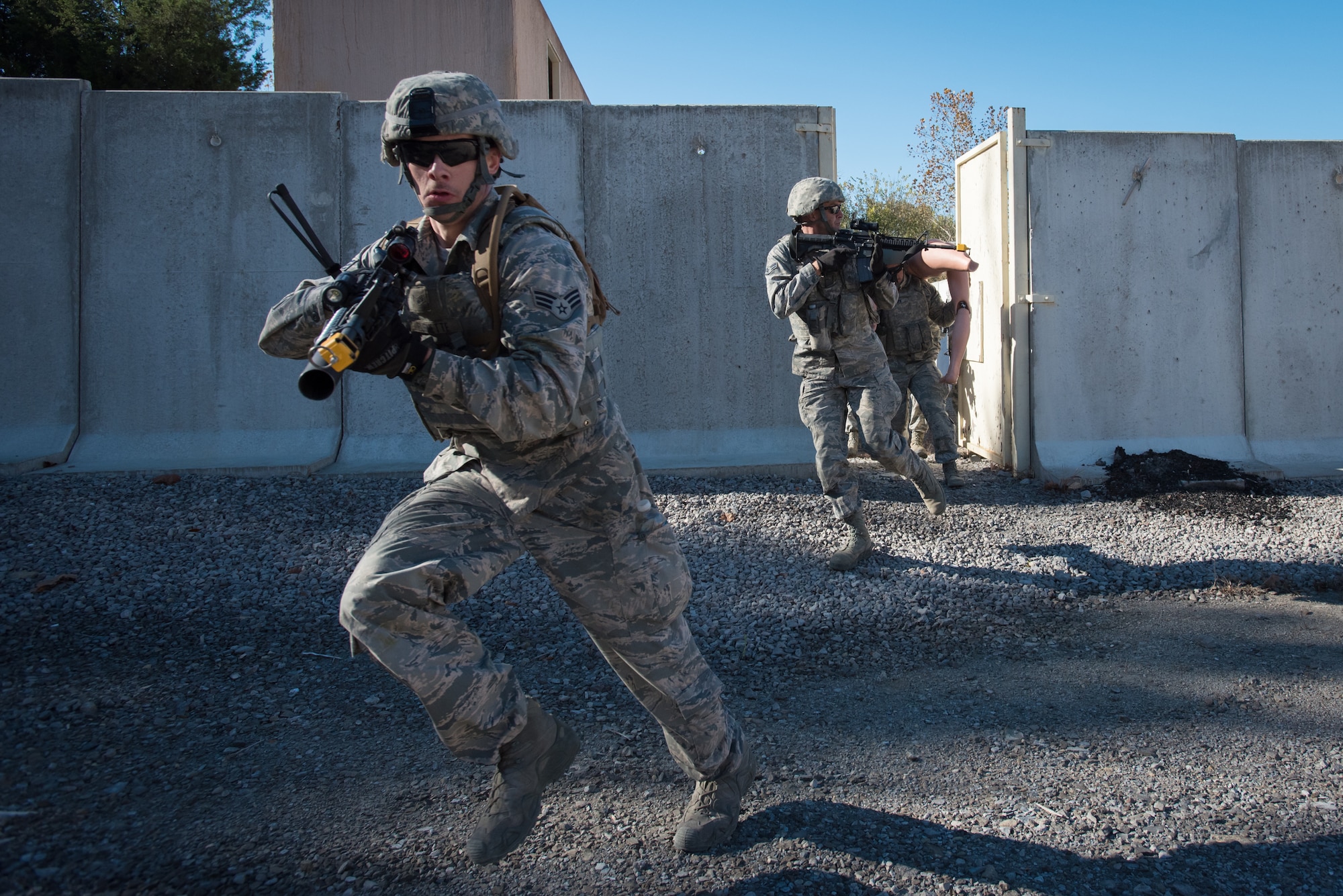Fire Team members from the Kentucky Air National Guard’s 123rd Security Forces Squadron conduct training to recover a simulated downed pilot inside a mock Afghan Village at Fort Knox, Ky., Oct. 20, 2015. The Airmen were required to execute a coordinated search while defending their positions and engaging hostile enemy forces. (U.S. Air National Guard photo by Maj. Dale Greer)