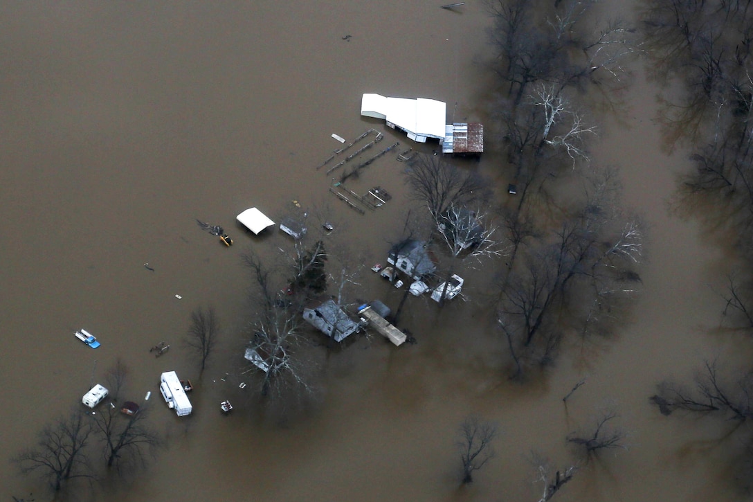 The effects of flooding in Pacific, Mo., are visible from a Missouri National Guard UH-60 Black Hawk helicopter flying over the region, Dec. 30, 2015. Missouri Gov. Jay Nixon; Army Maj. Gen. Stephen L. Danner, adjutant general of the state's National Guard; and members of an emergency management team surveyed flood-affected areas of the state from the helicopter. Missouri National Guard photo 