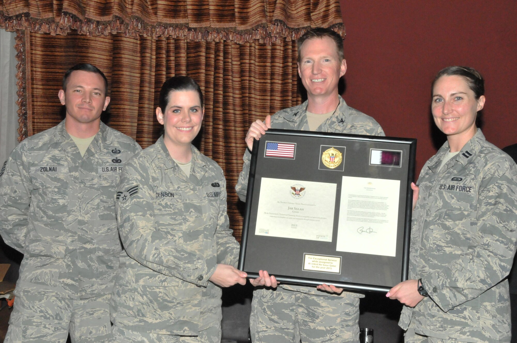 Col. Stuart Newberry, 379th Air Expeditionary Wing vice commander, stands with members of Jar Saleh’s executive committee, during a volunteer recognition event Dec. 29 at Al Udeid Air Base, Qatar. Jar Saleh received the Presidential Volunteer Service Award as an organization for their volunteer efforts. Jar Saleh also received a certificate of appreciation and a letter from President Barack Obama congratulating them on their community service. (U.S. Air Force photo by Tech. Sgt. Terrica Y. Jones/Released)