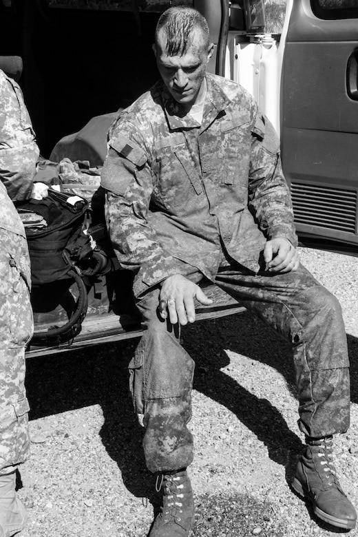 Staff Sgt. Russell Vidler, 98th Training Division (IET) Drill Sergeant of the Year, is given first aid after injuring himself at the confidence course during the 108th Training Command's combined Best Warrior and Drill Sergeant of the Year competition held at Fort Huachuca, Ariz., March 25, 2015. Vidler won the competition for the 98th and went on to face the winner from the 95th Training Division (IET) at the TRADOC level competition. (U.S. Army photo by Sgt. 1st Class Brian Hamilton)