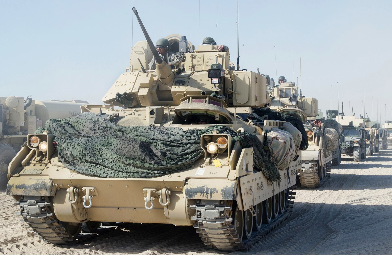 Soldiers from the Idaho Army National Guard's 2nd Squadron, 116th Cavalry Regiment prepare to head out on a training exercise at the National Training Center at Fort Irwin, California in August, 2015.