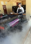 Senior Airman Laenya Maze, 36th Maintenance Squadron electrical and environmental technician, releases built up pressure from a liquid oxygen cart Dec. 1, 2015, at Andersen Air Force Base, Guam. Before a cart is transported to a jet, all built up pressure is released and the cart must pass inspection. 