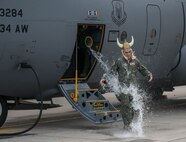 Col. Keith Wesley, 934th Airlift Wing commander, completes his fini-flight piloting a 934 AW C-130 Dec. 22. Wesley will move to his new position as Reserve Advisor to the Air Mobility Command Plans and Requirements at Scott AFB, Ill in January. (Air Force Photo/Capt. William-Joseph Mojica)