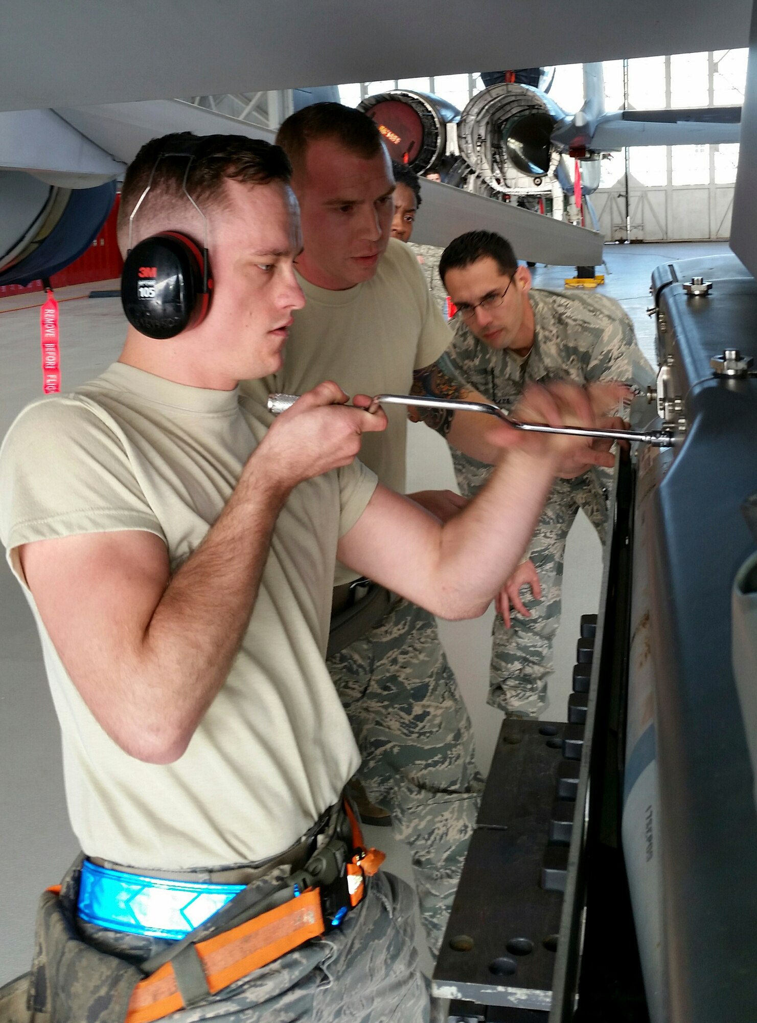 Airman 1st Class William Walters, of the 96th Aircraft Maintenance Squadron Blue, locks a GBU-39 small diameter bomb into the BRU-61 rack of the F-16 Fighting Falcon, during the fourth quarter weapons loadcrew competition Dec. 18 at Eglin Air Force Base, Fla.  Walters, Staff Sgt. Jason Vermillion and Senior Airman Derron Ackermann represented the Blue AMU. The Blue team defeated the Red team in the competition. (U.S. Air Force photo/Kevin Gaddie) 