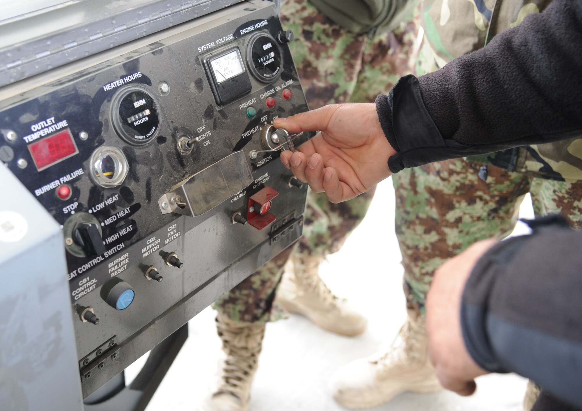 An Afghan airman starts a new generation heater during the hands-on portion of C-130 lead-in training, which is being provided prior to formal maintenance training in the US. Having the ability to maintain C-130s is an important step toward an independent Afghan Air Force. (US Air Force photo by Senior Master Sgt. J. LaVoie/Released) 