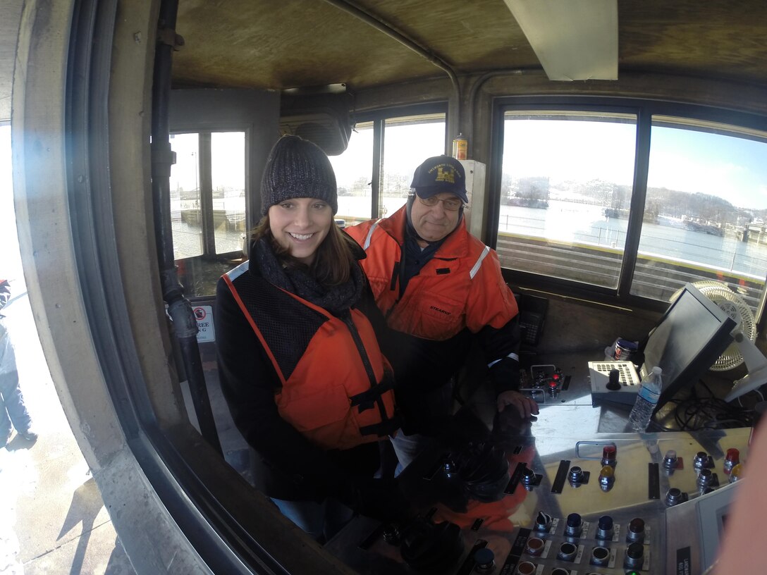 University of Pittsburgh graduate student Abigail Wolensky operates levers that open the main chamber mitre gates during a lockage at Emsworth Locks and Dam on the Ohio River near Pittsburgh. 