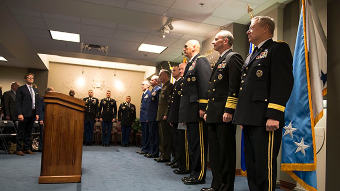 Members of the Joint Chief of staff stand at attention for the signing of a "28-star" Letter at the Pentagon, Feb. 2, 2015.  The letter challenges transitioning service members to continue serving their community and encouraged greater involvement between veterans and the public.  (U.S. Marine Corps photo by Sgt. Jose D. Lujano/released)