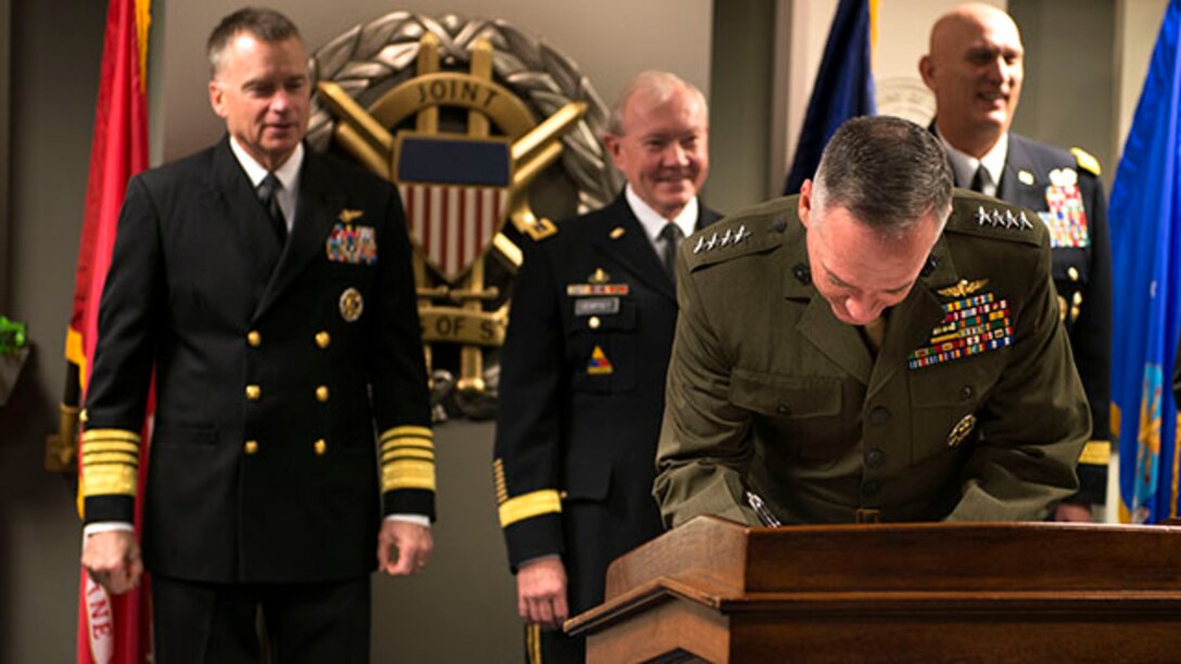 The 36th Commandant of the Marine Corps Gen. Joseph Dunford signs a "28-star" Letter at the Pentagon, Feb. 2, 2015. The letter challenges veterans, who have served since 9/11, to continue being leaders and becoming assets in their communities following the end of their active-duty military career.