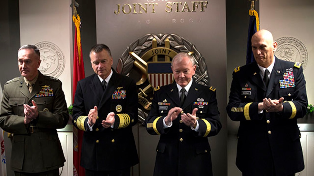 Members of the Joint Chiefs of staff applaud for the conclusion of the signing of the "28-star" Letter at the Pentagon, Feb. 2, 2015.  The letter challenges transitioning service members to continue serving their community and encouraged greater involvement between veterans and the public.  (U.S. Marine Corps photo by Lance Cpl. Remington Hall/released)