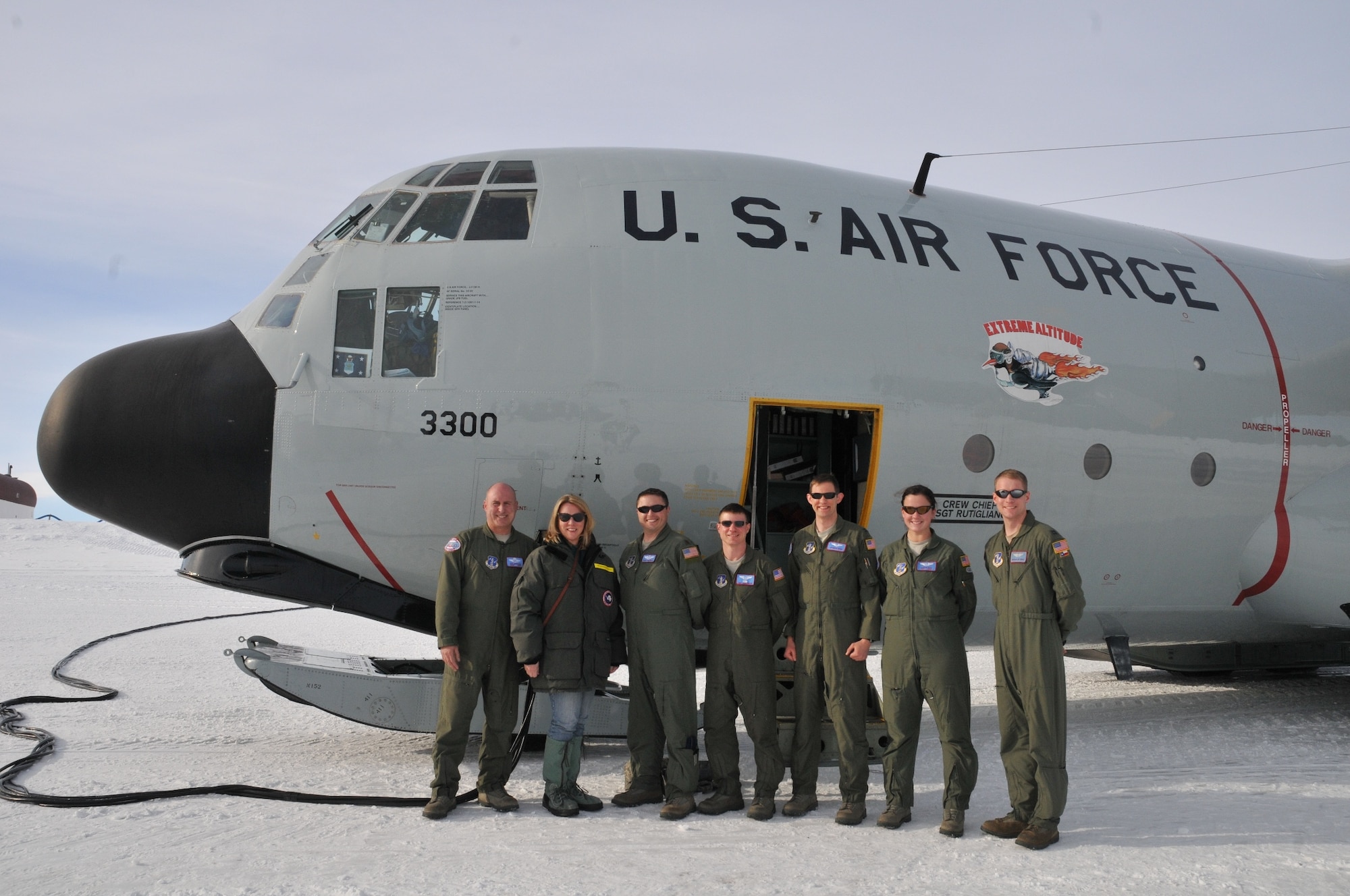 Secretary of the Air Force Deborah Lee James (second to the left) poses for a photo with aircrew from the 139th Expeditionary Airlift Squadron in front of a LC-130 Hercules during her visit with participants of Operation DEEP FREEZE, at McMurdo Station, Antarctica, Jan. 25, 2015. DEEP FREEZE involves active duty and Reserve C-17 Globemaster III support from Joint Base Lewis-McChord, Wa., LC-130 Hercules support from the New York Air National Guard, sealift support from the U.S. Coast Guard and Military Sealift Command, engineering and aviation services from U.S. Navy Space and Naval Warfare Systems Command, and cargo handling from the U.S. Navy. Operation DEEP FREEZE 2015 is part of the U.S. Antarctic program, which is managed by the National Science Foundation. (U.S. Air Force courtesy photo)