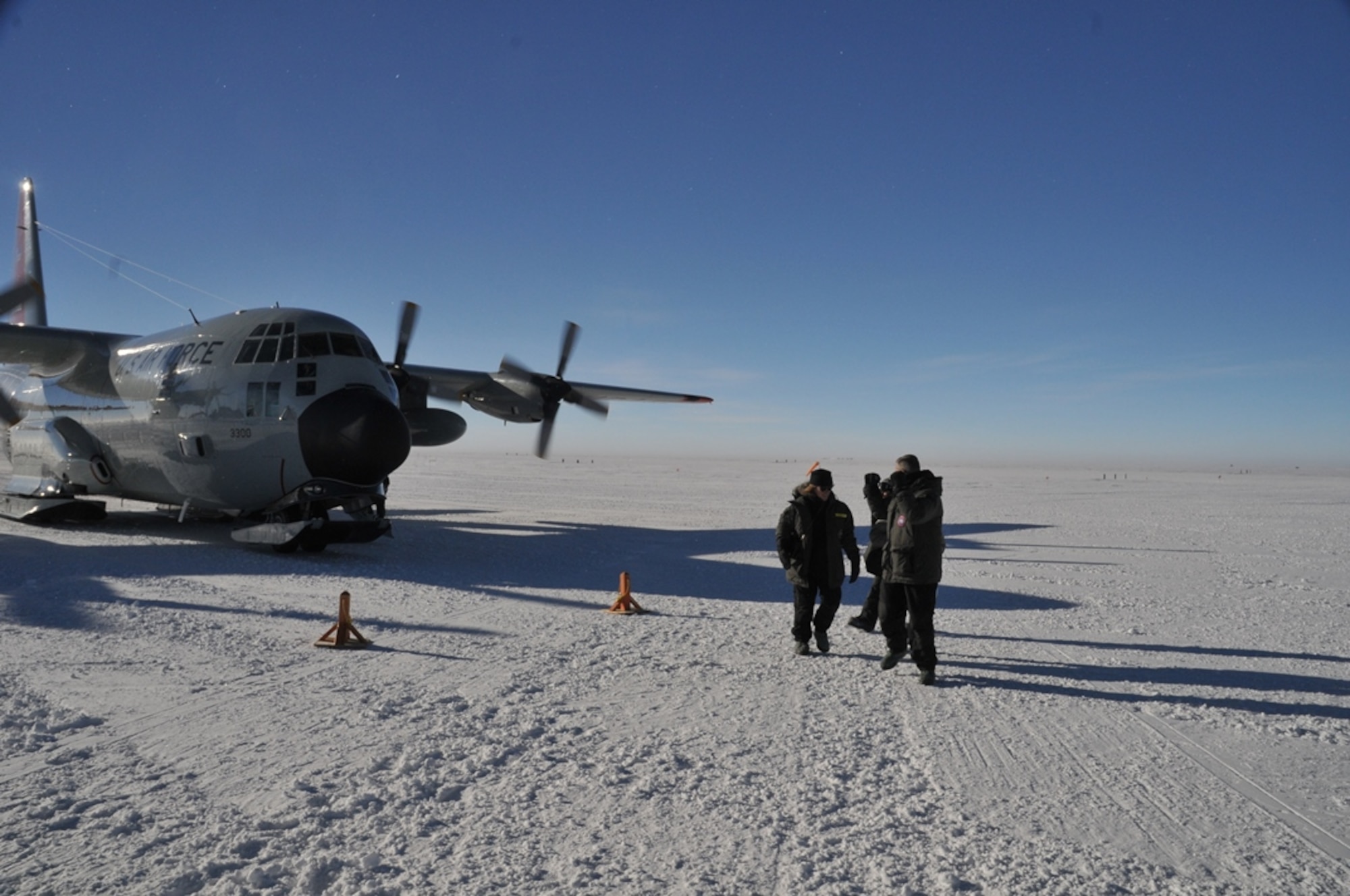 Secretary of the Air Force Deborah Lee James (left) walks from a LC-130 Hercules with aircrew from the 139th Expeditionary Airlift Squadron during her visit with participants of Operation Deep Freeze, at McMurdo Station, Antarctica, Jan. 25, 2015. DEEP FREEZE involves active duty and Reserve C-17 Globemaster III support from Joint Base Lewis-McChord, Wa., LC-130 Hercules support from the New York Air National Guard, sealift support from the U.S. Coast Guard and Military Sealift Command, engineering and aviation services from U.S. Navy Space and Naval Warfare Systems Command, and cargo handling from the U.S. Navy. Operation DEEP FREEZE 2015 is part of the U.S. Antarctic program, which is managed by the National Science Foundation. (U.S. Air Force courtesy photo)