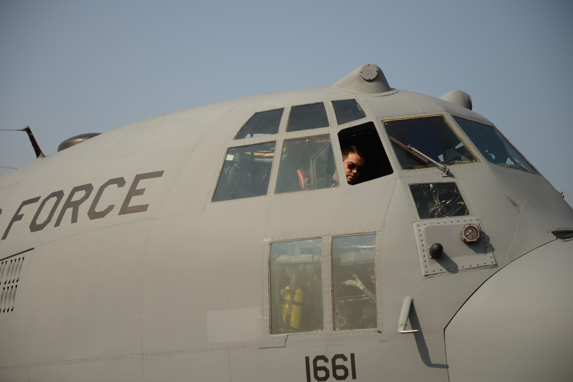 U.S. Air Force Capt. Travis Wilkes, a C-130H aircraft pilot assigned to the 36th Airlift Squadron, Yokota Air Base, Japan, prepares for a mission during Exercise COPE SOUTH at BAF Base Bangabandhu,  Bangladesh, Jan. 28, 2015. COPE SOUTH is a Pacific Air Forces-sponsored, bilateral tactical airlift exercise conducted in Bangladesh, with a focus on cooperative flight operations, day and night low-level navigation, tactical airdrop, and air-land missions as well as subject-matter expert exchanges in the fields of operations, maintenance and rigging disciplines. (U.S. Air Force photo by 1st Lt. Jake Bailey/Released)