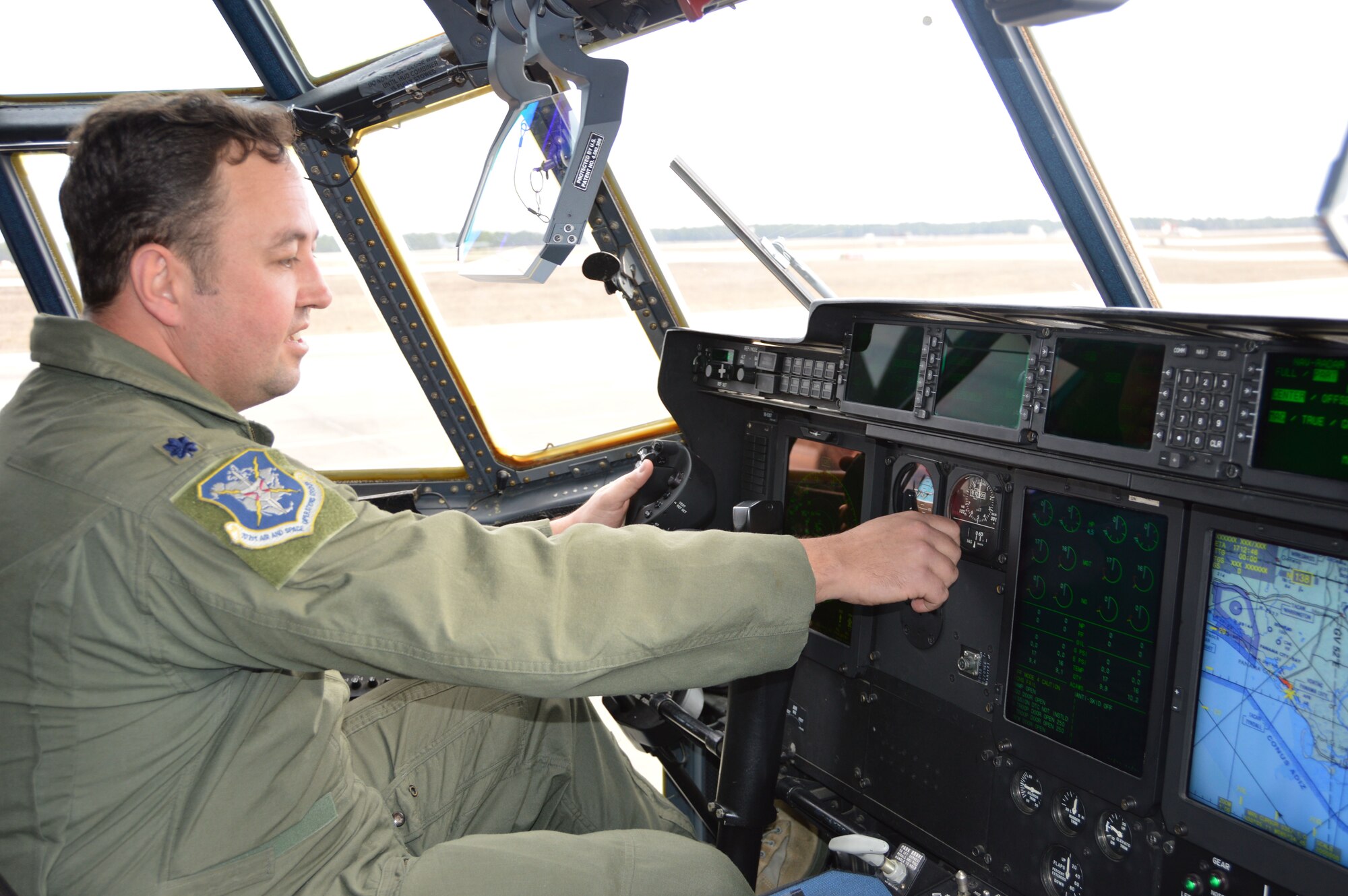 TYNDALL AIR FORCE BASE, Fla. - Lt. Col. Ralph Clark, of the 601st Air Operations Center Air Mobility Division, checks out the instruments in the cockpit of a WC-130J “Hurricane Hunter” that was visiting here. Clark is a C-130H pilot. The WC-130J aircraft and crew, assigned to the 53rd Weather Reconnaissance Squadron, Keesler Air Force Base, Miss., a Reserve unit, were part of an Air Forces Northern two-day working group who met to discuss WC-130J mission capabilities. Prior to their departure, they opened the aircraft to tours for Tyndall members and local media representatives. (U.S. Air Force photo by Mary McHale/Released)