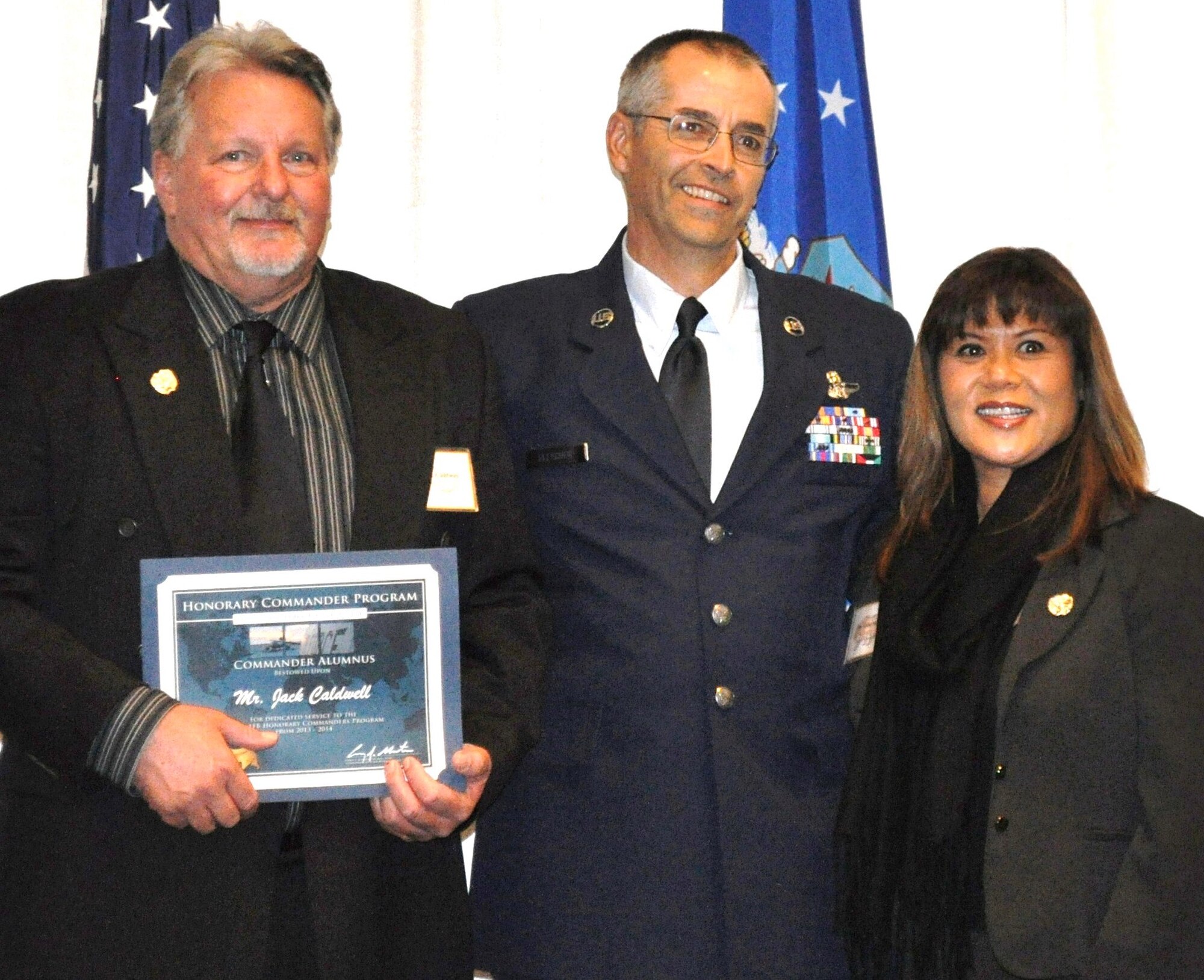 TRAVIS AIR FORCE BASE, Calif. -- On behalf of the 312th AS Commander, Lt. Col. Dan Stout, CMSgt. Robert Fletcher bid farewell to outgoing honorary commander, Jack Caldwell, and welcomed incoming honorary, Mabel Salon. Caldwell, a new addition to the Travis Regional Armed Forces Committee Board of Directors, will join the Alumni ranks of the Travis HCC. (U.S. Air Force photo/Ellen Hatfield)