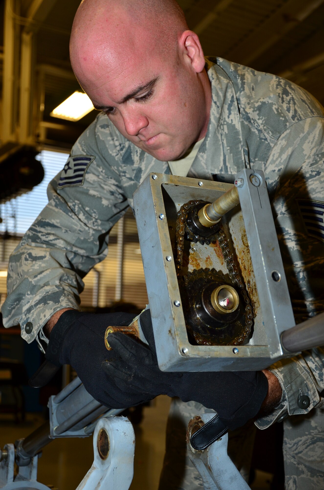 Tech Sgt. Ralph Guevara, Aerospace Ground Equipment craftsman assigned to the 403rd Maintenance Squadron, repairs an aircraft tow bar 30 Jan 2015 in the Roberts Consolidated Maintenance Facility at Keesler Air Force Base, Biloxi, Miss. The AGE shop is responsible for the maintenace and repair of all ground equipment assigned to the 403rd Wing. 
(U.S. Air Force Photo/Master Sgt. Brian Lamar)