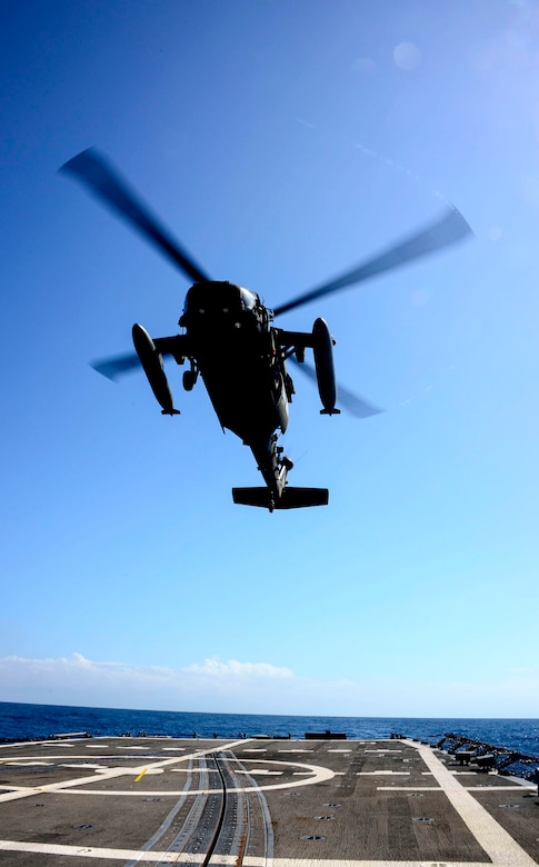 A UH-60 helicopter, assigned to the 1st Battalion, 228th Aviation Regiment makes an approach to the USS Kauffman during deck landing qualifications off the coast of  Honduras, Feb. 1, 2015.  The 1-228th Avn. Reg. aircrew participated in deck landing qualifications on board the USS Kauffman to qualify pilots and crew chiefs on shipboard operations.  Kauffman is on its final scheduled deployment to the U.S. Southern Command area of responsibility supporting multinational, counter-narcotics operation known as Operation Martillo. (U.S. Air Force photo/Tech. Sgt. Heather Redman)